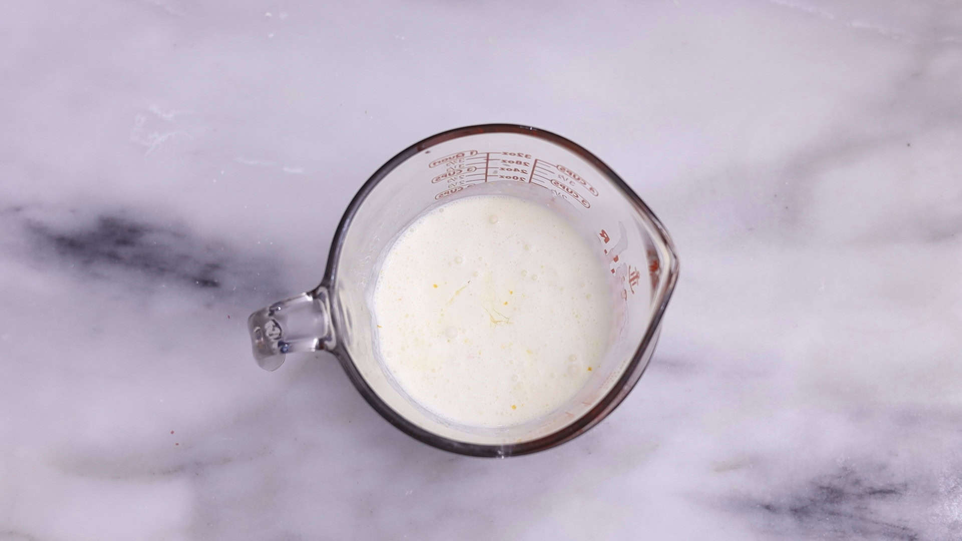 In a separate bowl, whisk together the cold heavy cream, orange juice, Grand Marnier, vanilla, zest, and eggs until combined.