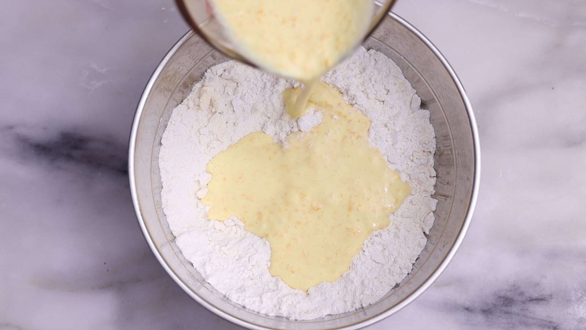 In a separate bowl, whisk together the cold heavy cream, orange juice, Grand Marnier, vanilla, zest, and eggs until combined. 3