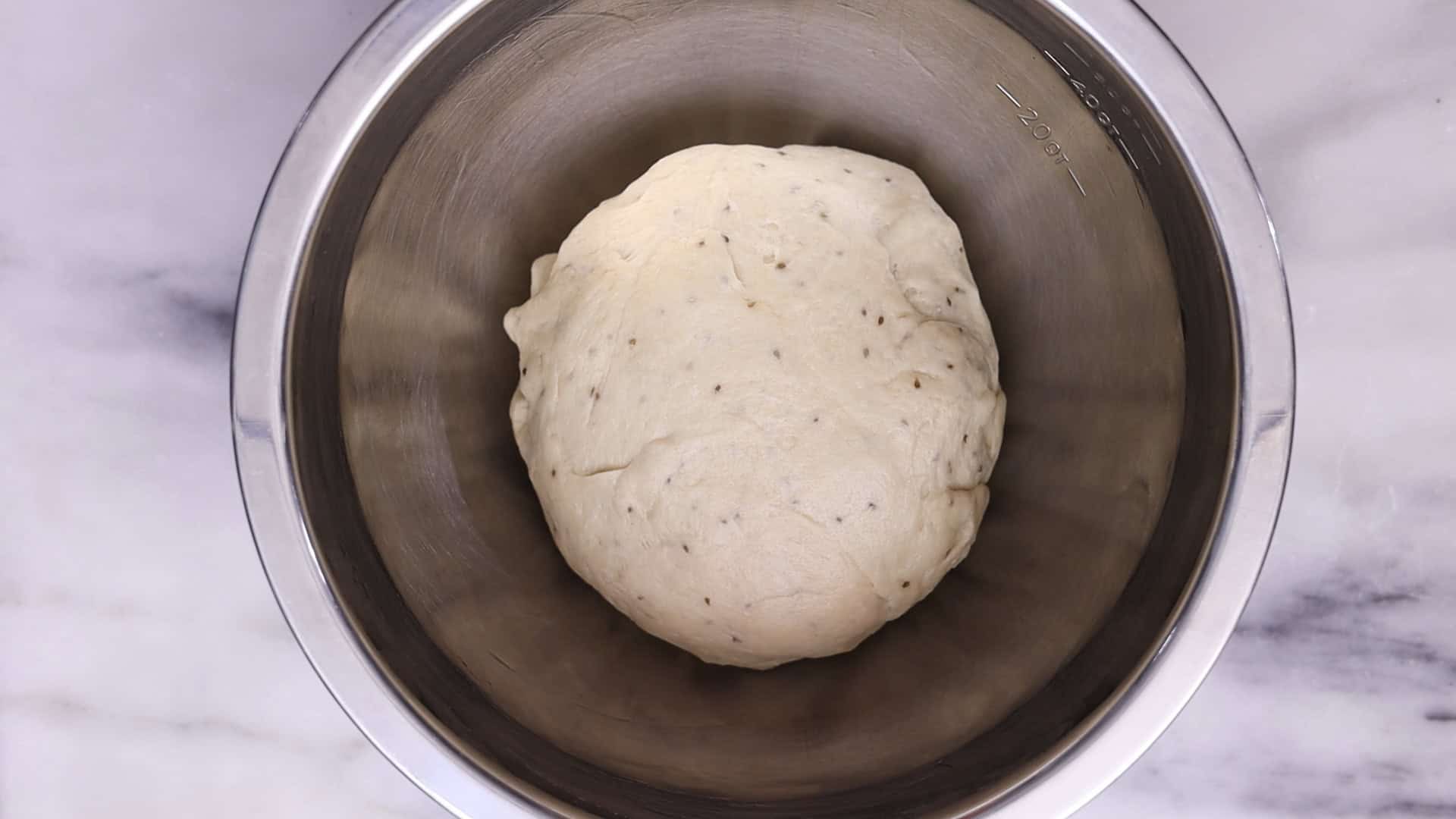 Lightly oil a bowl and your hands. Transfer the dough, form it into a ball, cover it, and let it rest for 15 minutes.