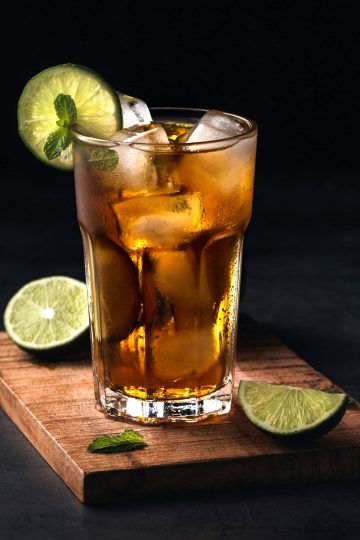 A glass of carrulim with lime, rue and mint.