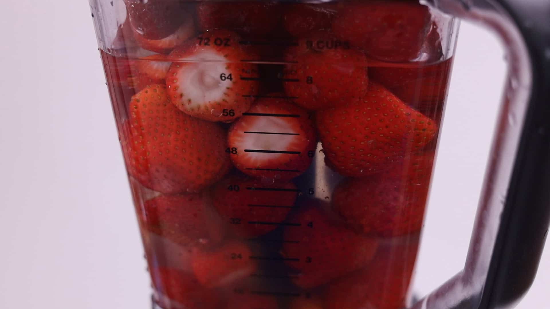 Add sugar and freshly squeezed lemon juice to the blender, along with 2 cups of water.