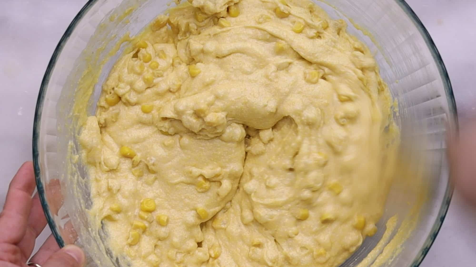 Combine wet and dry ingredients until just combined, then fold in corn. 4/4