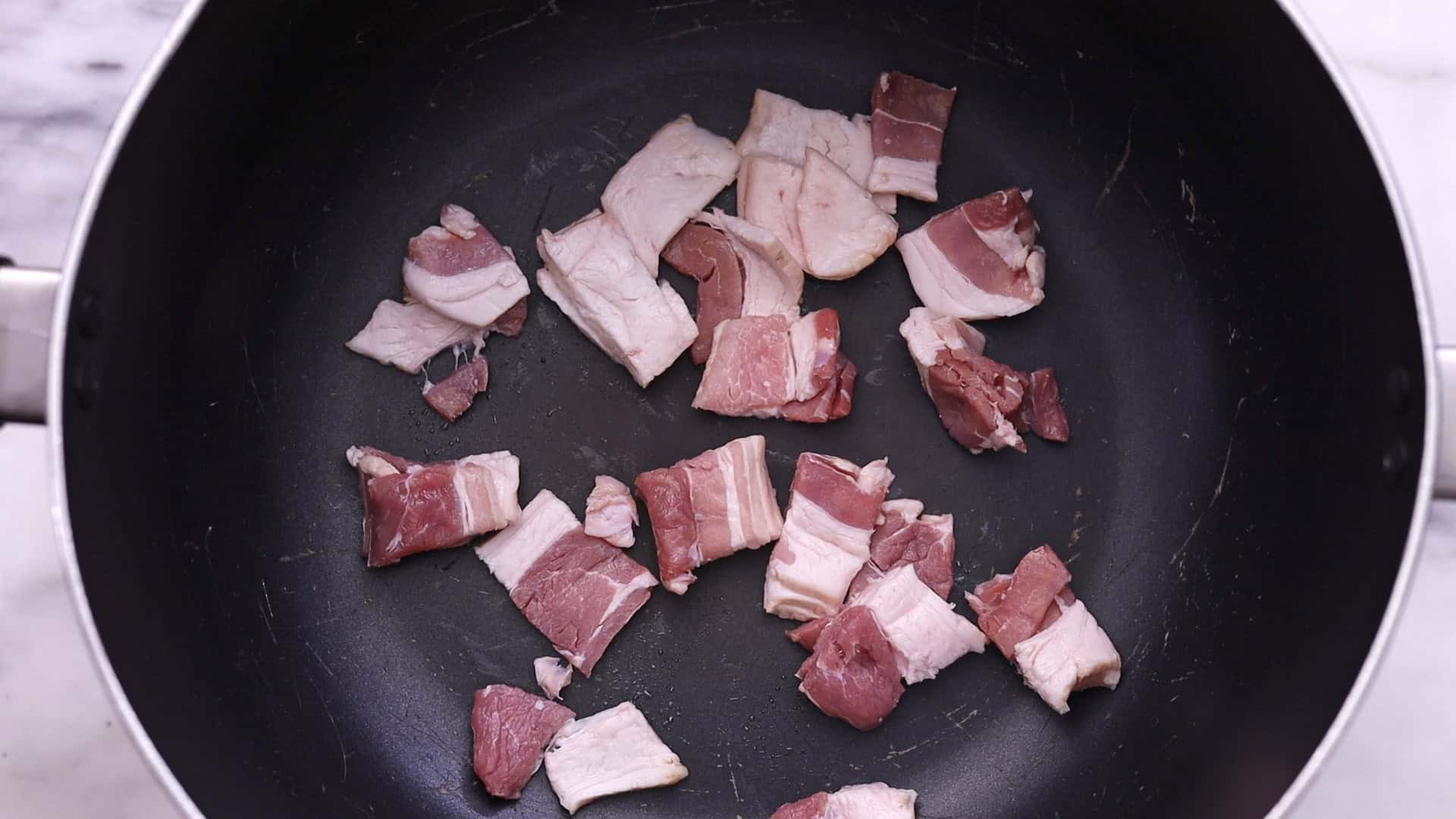 Sauté bacon, onions, and garlic in the remaining fat.