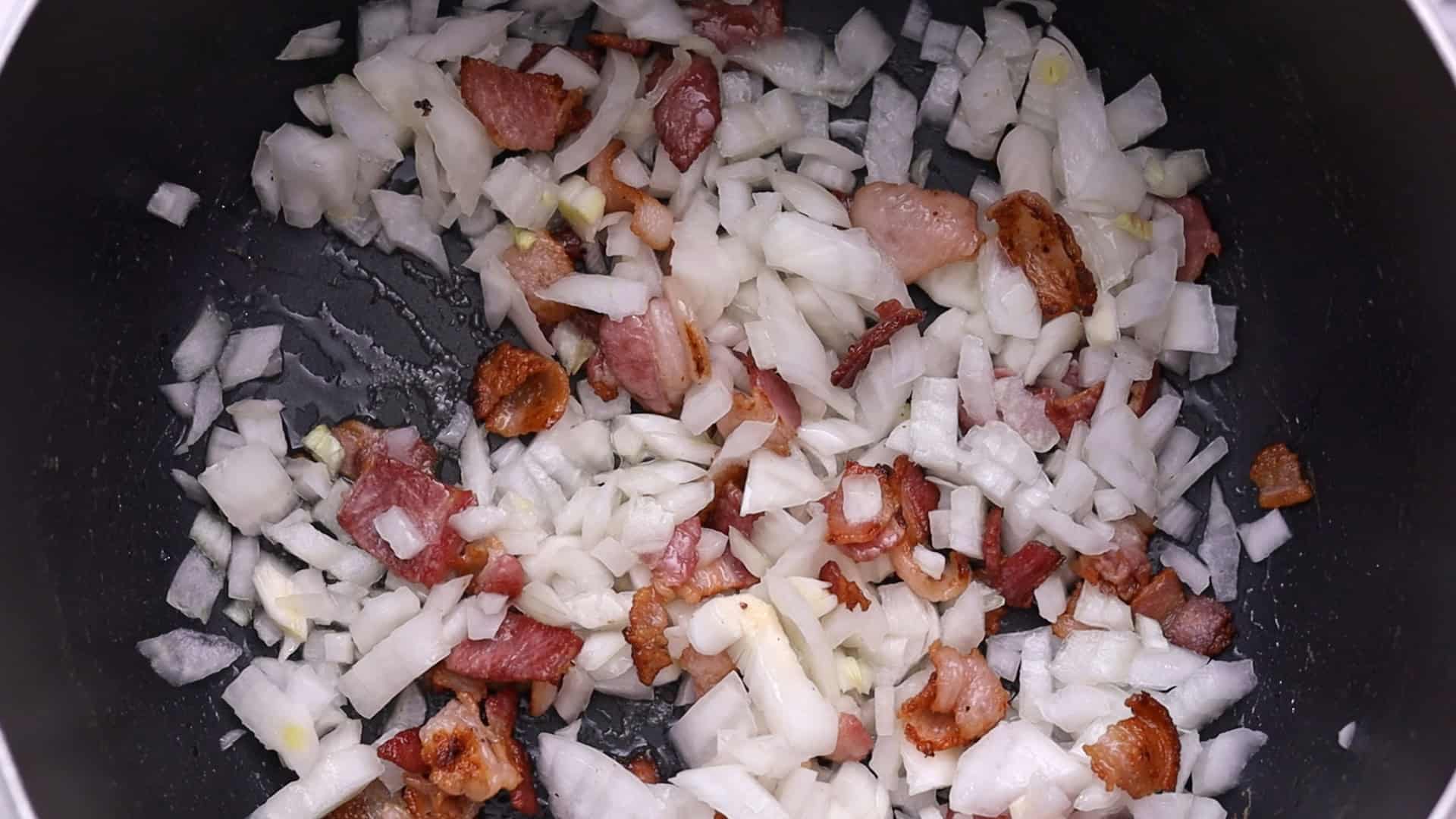Sauté bacon, onions, and garlic in the remaining fat.
