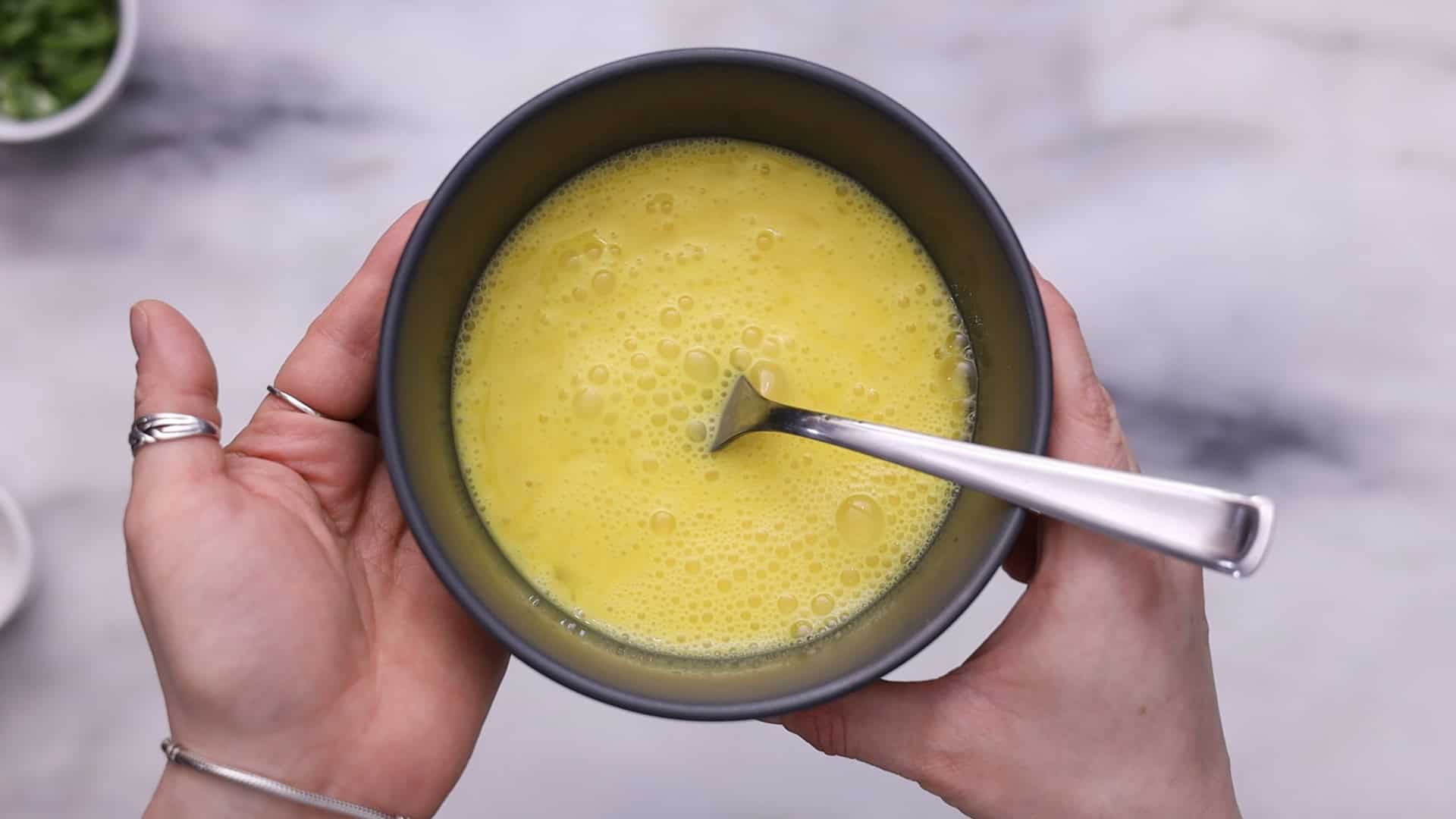 Beat eggs with salt, pour into the soup to form ribbons, and gently Stir .