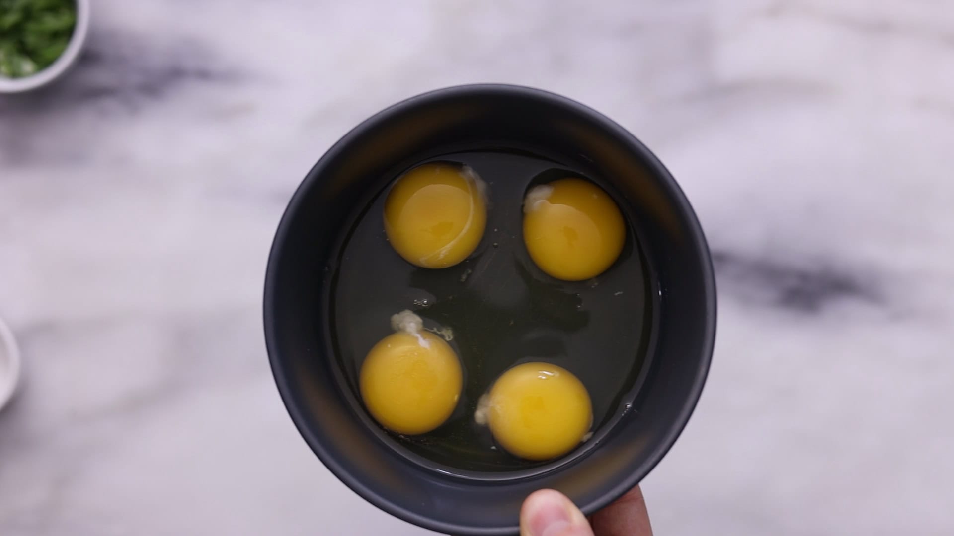Beat eggs with salt, pour into the soup to form ribbons, and stir gently