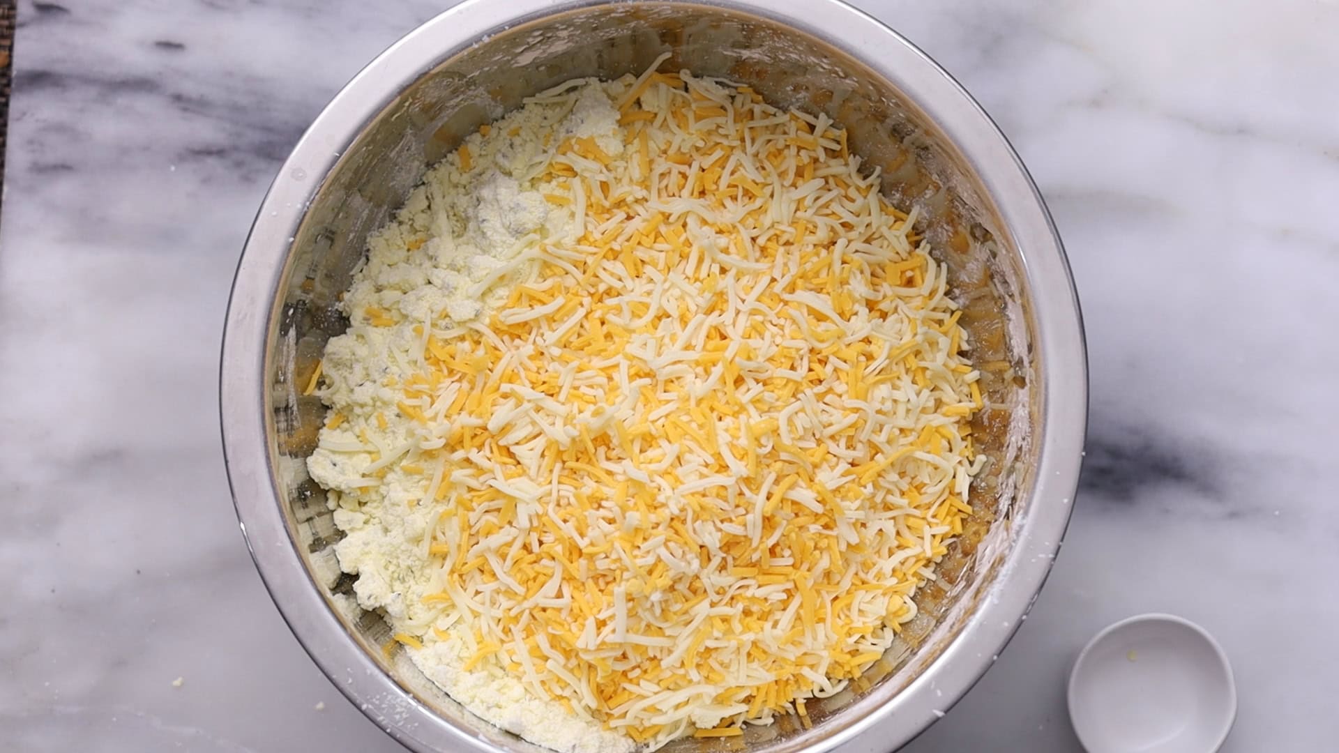 Combine wet and dry ingredients until a coarse crumb forms and add Cheese