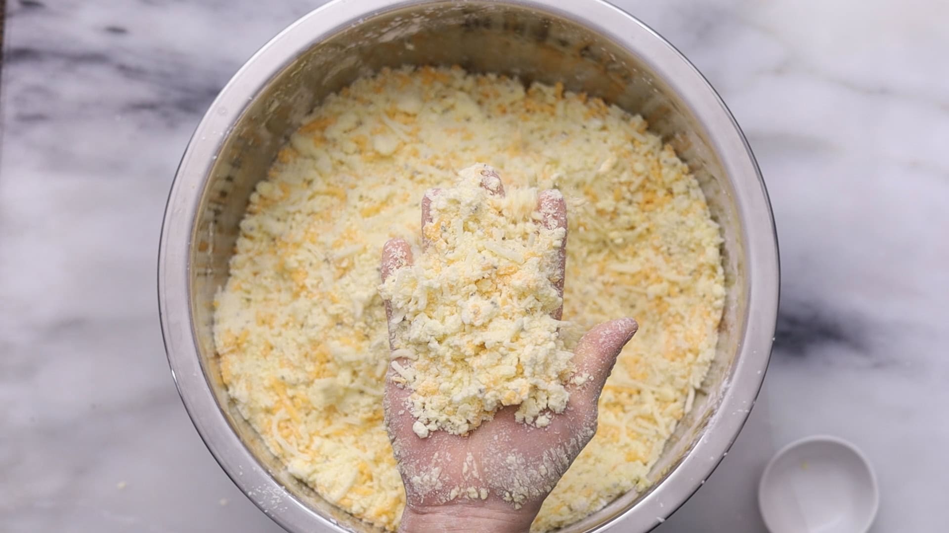 Combine wet and dry ingredients until a coarse crumb forms.Add cheese.