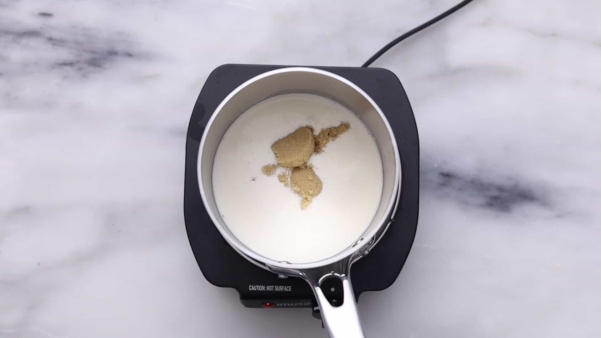 Heat cream and sugar until dissolved