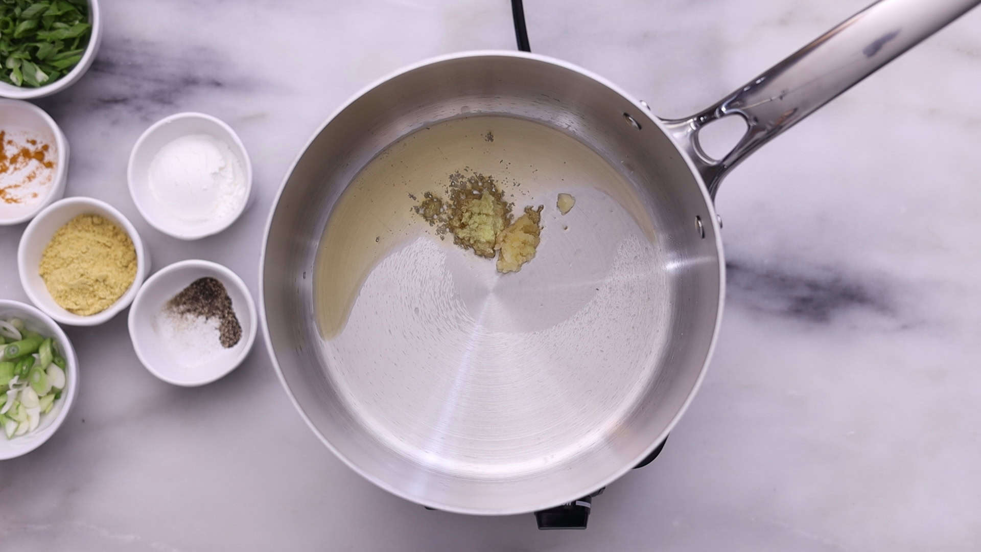 Heat oil and sauté garlic, ginger