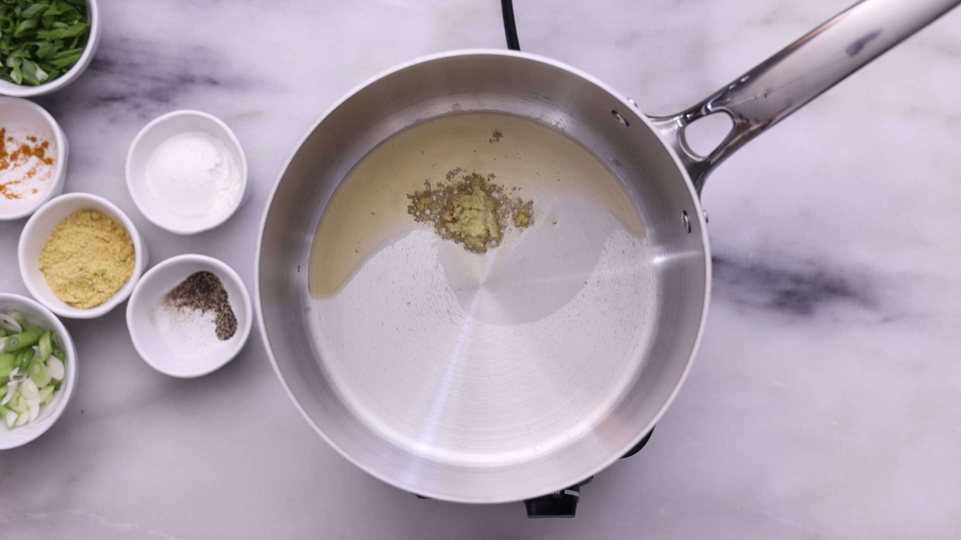 Heat oil and sauté garlic