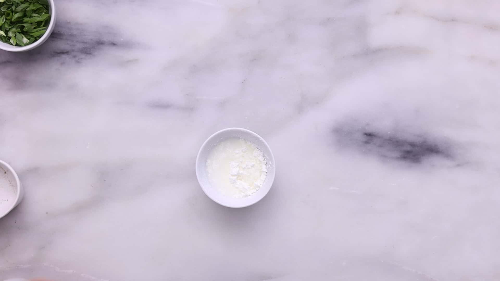 Prepare a cornstarch slurry, add it to the soup, and simmer to thicken