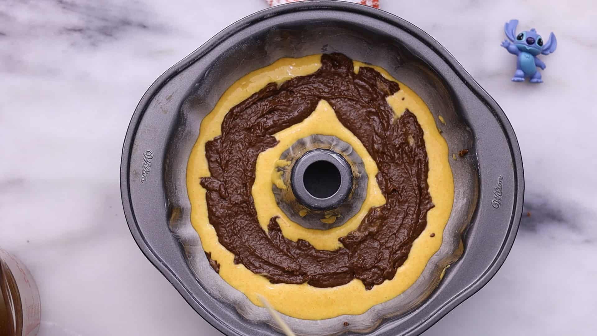 Marble Bundt Carrot Cake 29 Alternate spooning carrot and chocolate batter