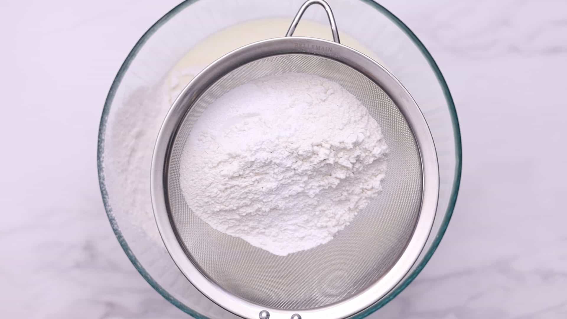 Mix flour and baking powder in a bowl