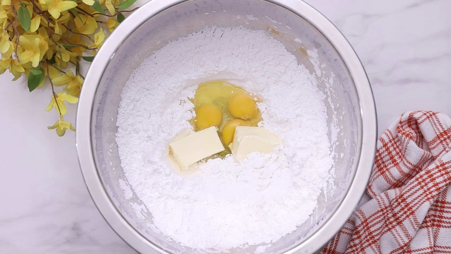 Add butter and eggs;