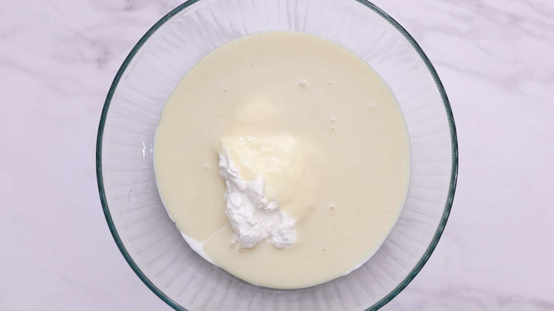 Blend condensed milk, water, and plain yogurt for 2 minutes.