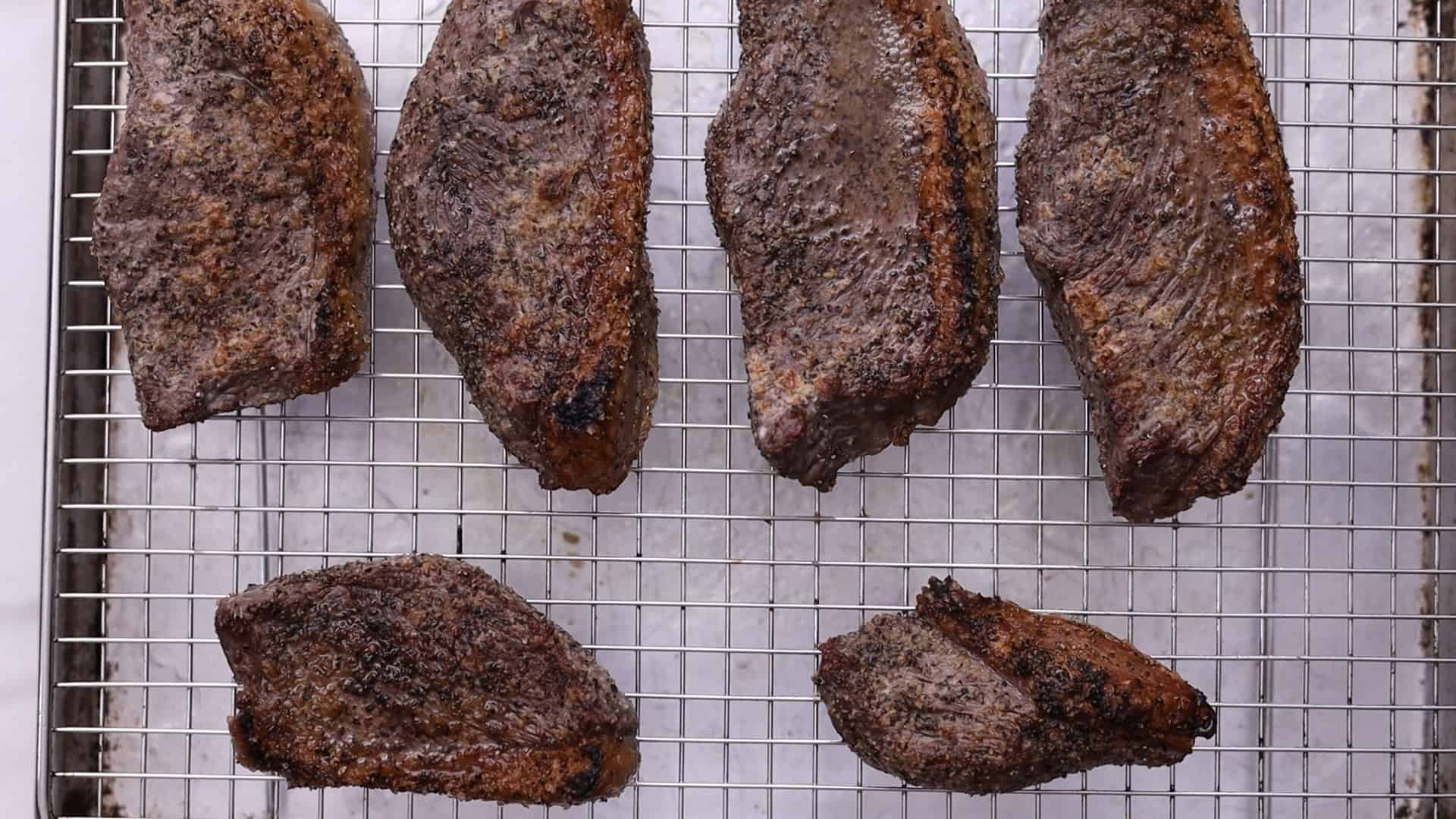 Broil close to the heat for 6 minutes until the fat is crispy. Squeeze lemon juice over meat, flip, and broil for another 6 minutes (135°F for medium-rare, 145°F for medium).