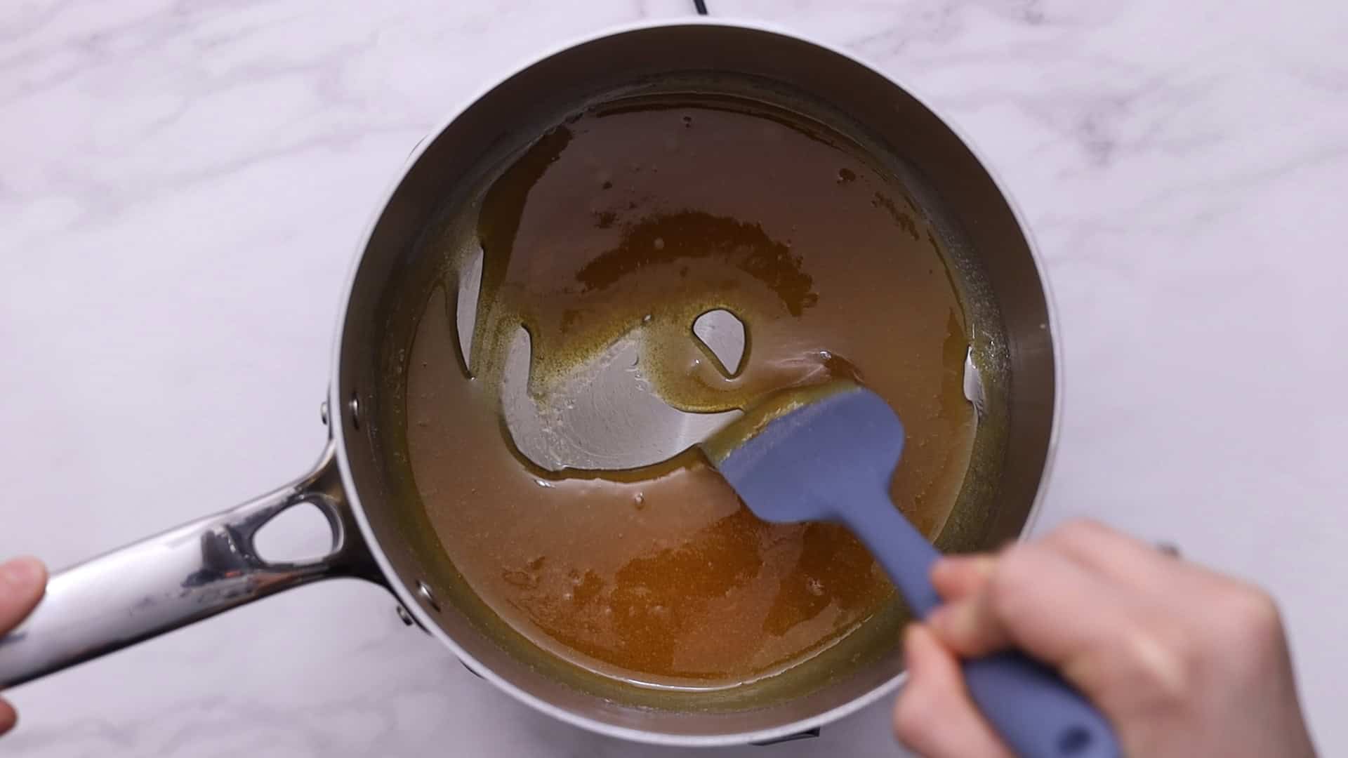 Heat sugar in a saucepan over medium heat, stirring until golden caramel forms. 