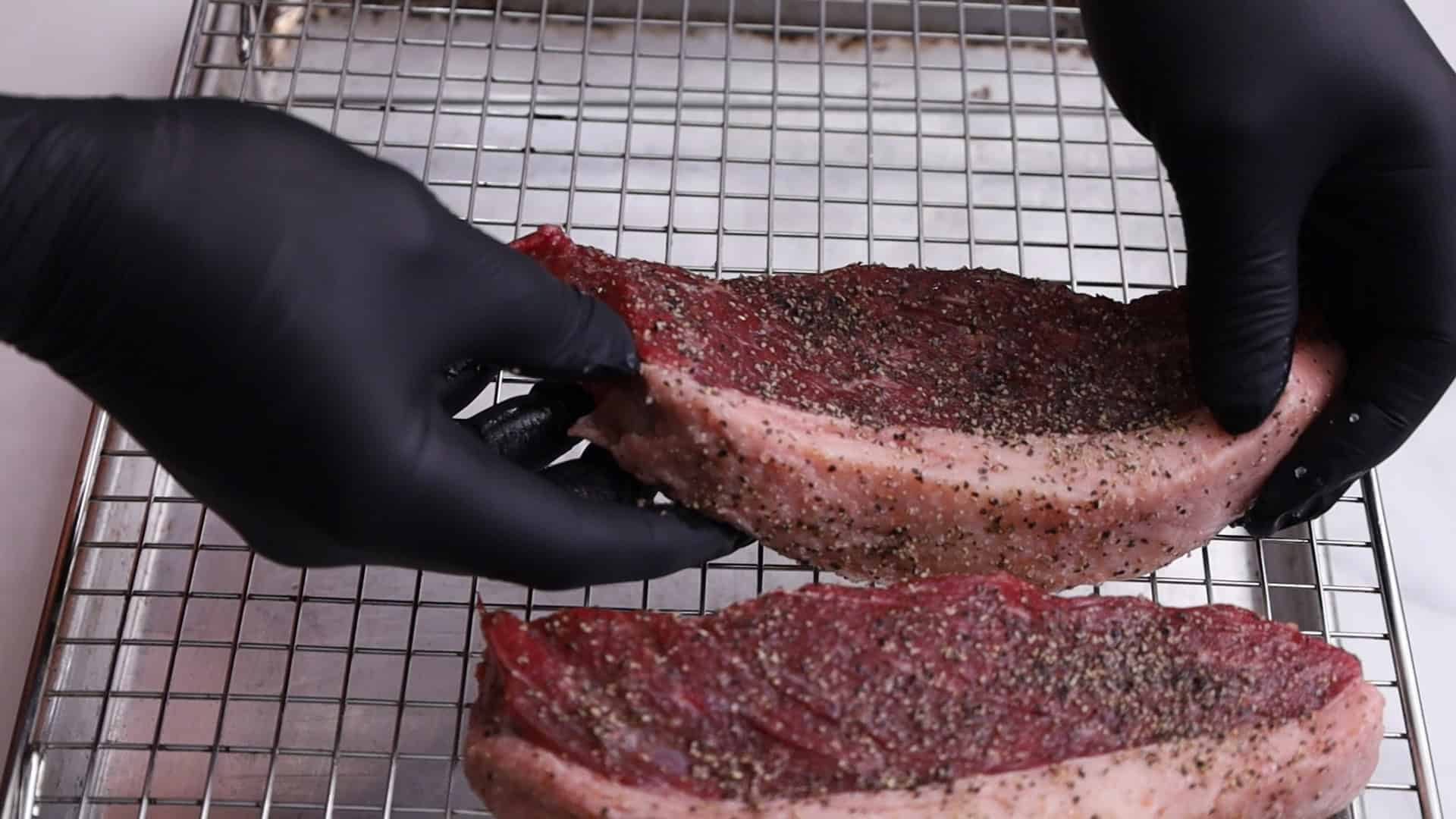 Place on a broiler pan or wire rack set on a baking sheet, fat side up if whole. Add ½ cup of water to the pan.
