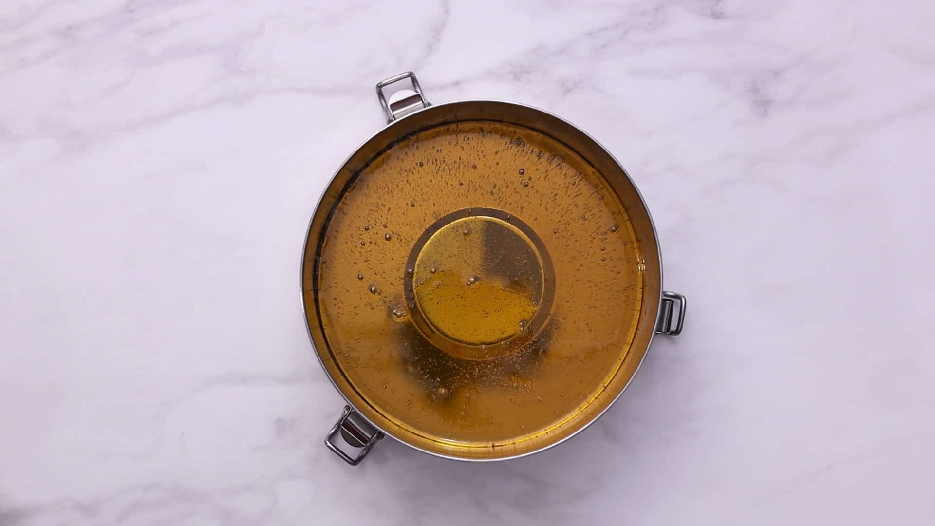 Pour caramel into a 1.5-qt flan mold, swirl to coat sides, and set aside.