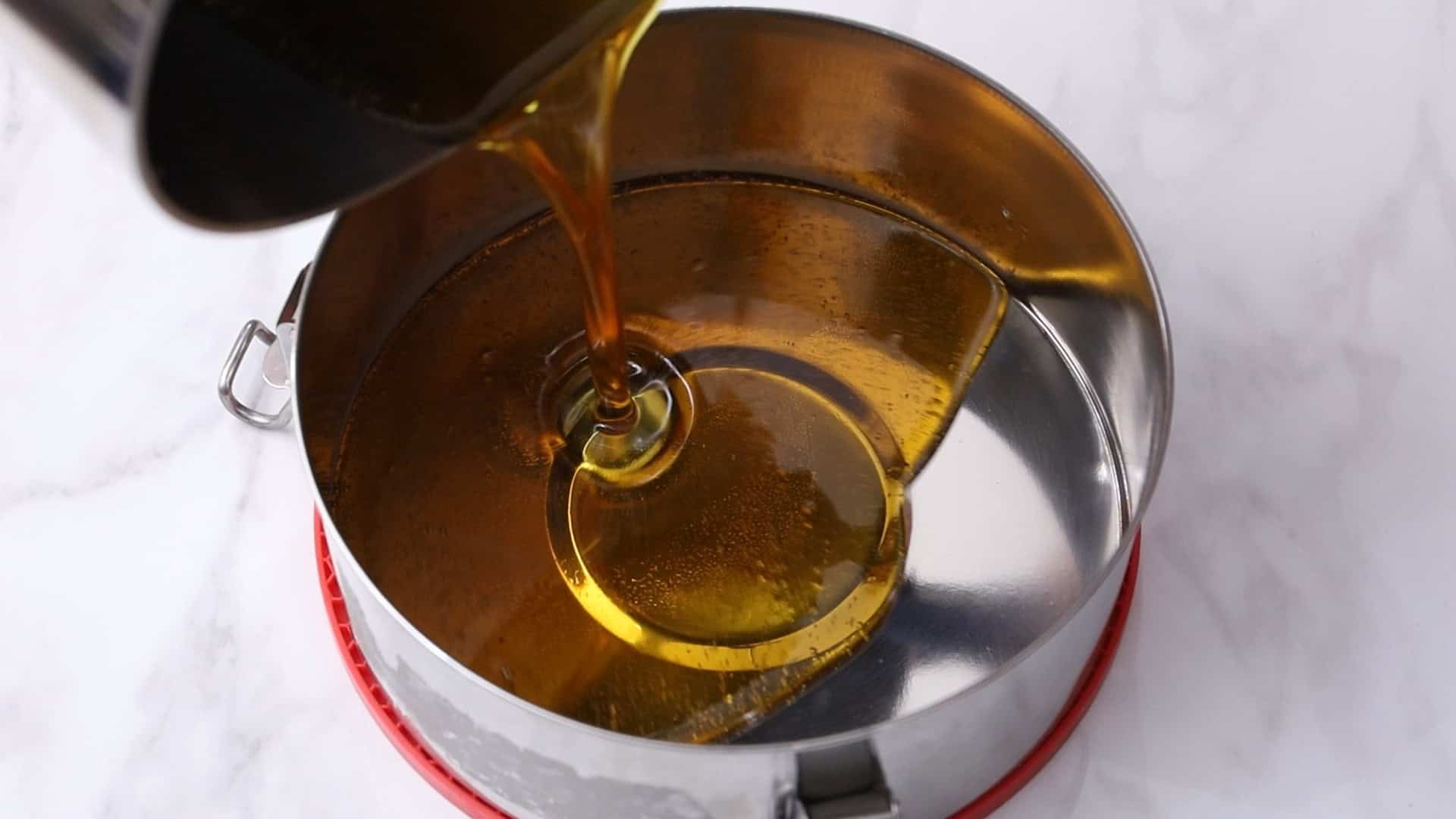 Pour caramel into a 1.5-qt flan mold, swirl to coat sides_1.27.1
