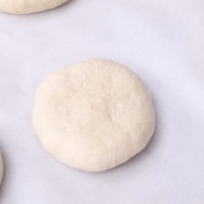 Shape into balls, flatten, place on a parchment-lined baking sheet