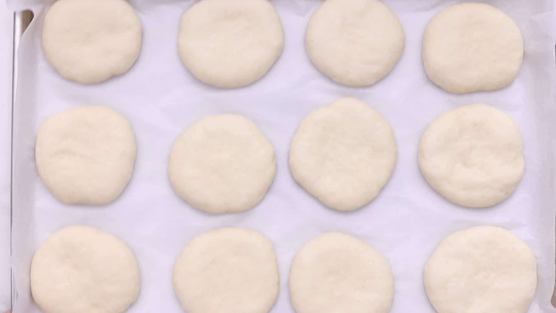 Homemade Burger Buns (Pan de Hamburguesa) 25 Shape into balls, flatten, place on a parchment-lined baking sheet, cover, and let rise for 30 to 45 minutes.