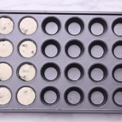 Spray a 24-cup mini muffin pan with oil and fill it with batters.