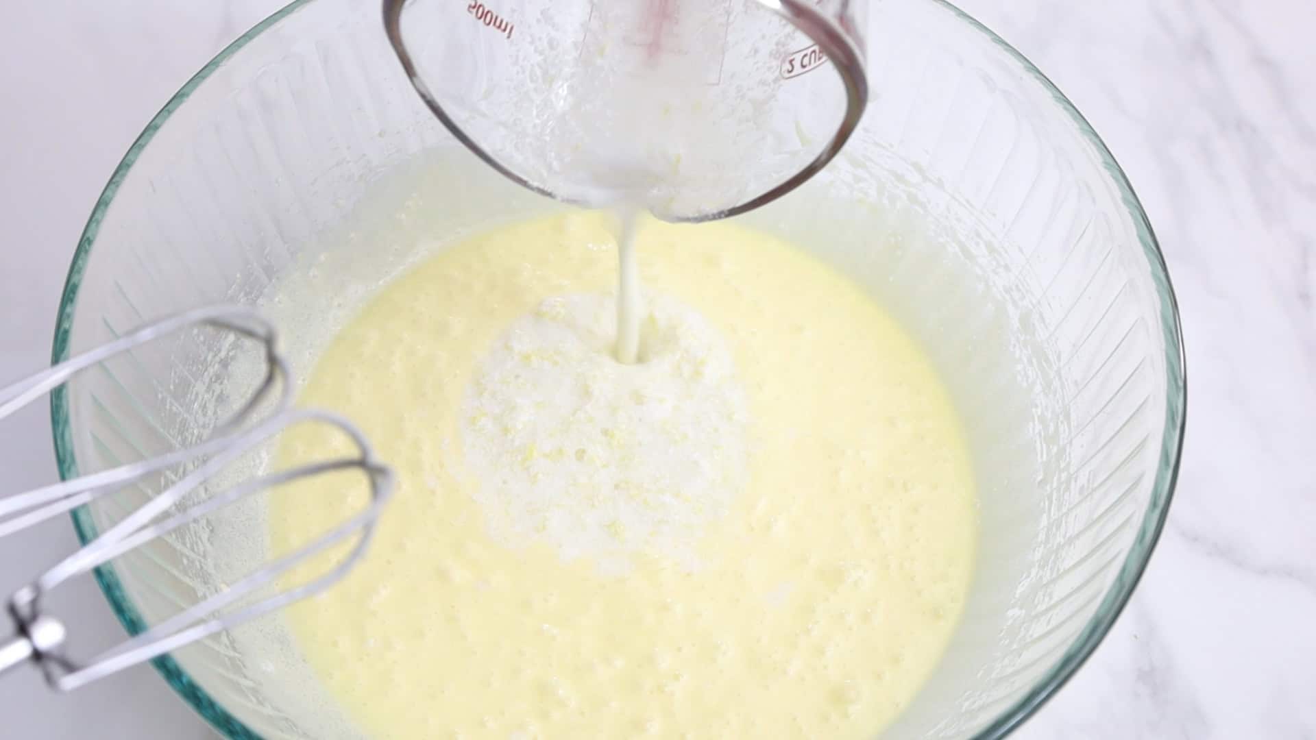 On low speed, alternate adding flour and milk mixture in 3 parts, starting and ending with flour. Mix until combined. ¼