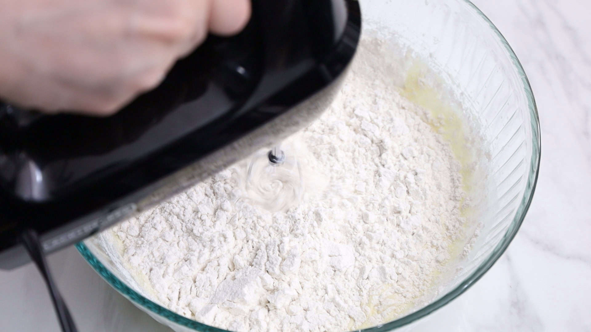 On low speed, alternate adding flour and milk mixture in 3 parts, starting and ending with flour. Mix until combined. ¾