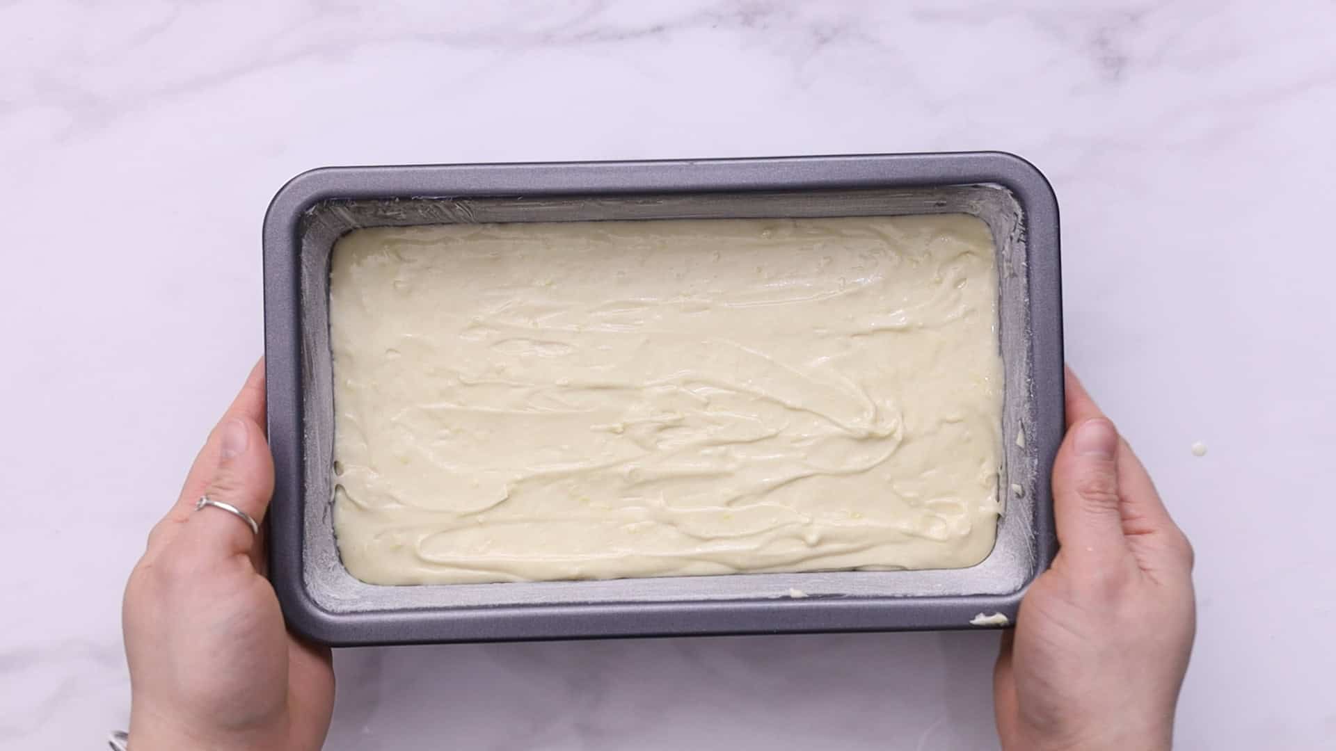 Pour batter into the prepared pan and smooth the top.