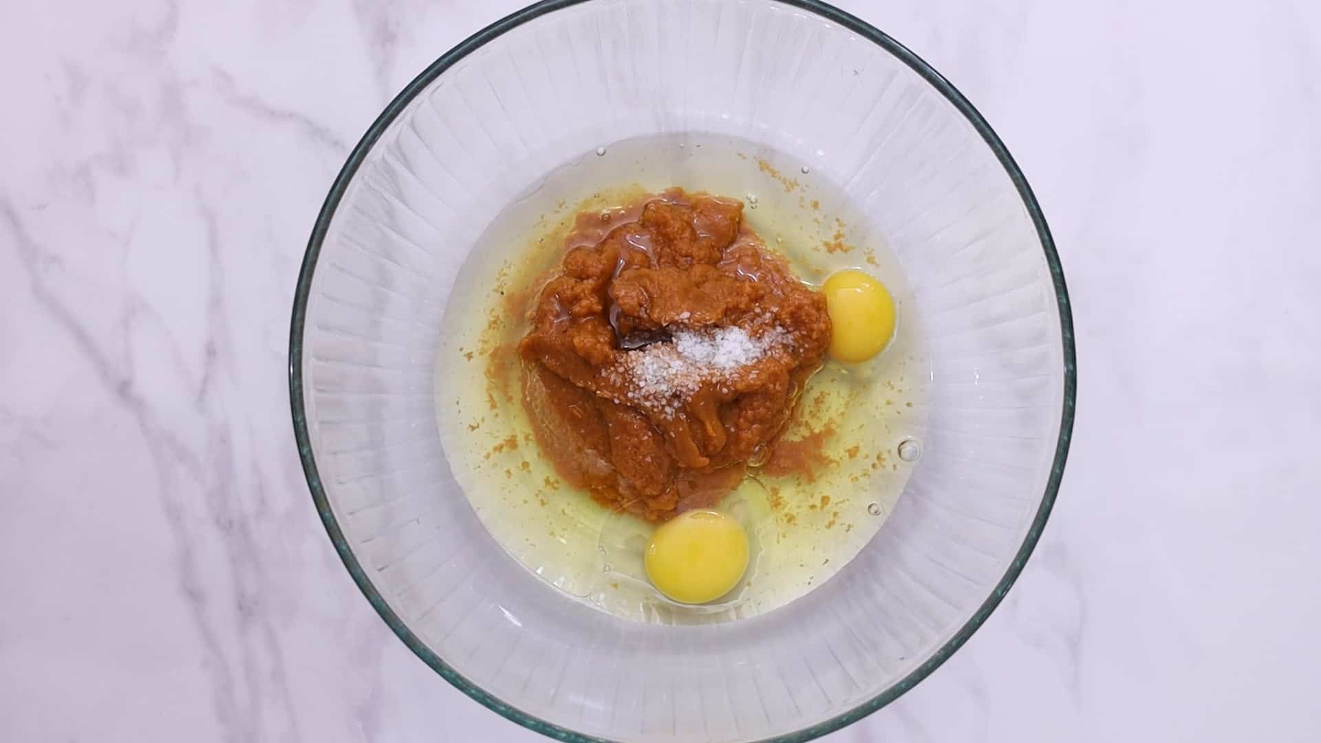 Whisk eggs, sugars, pumpkin puree
