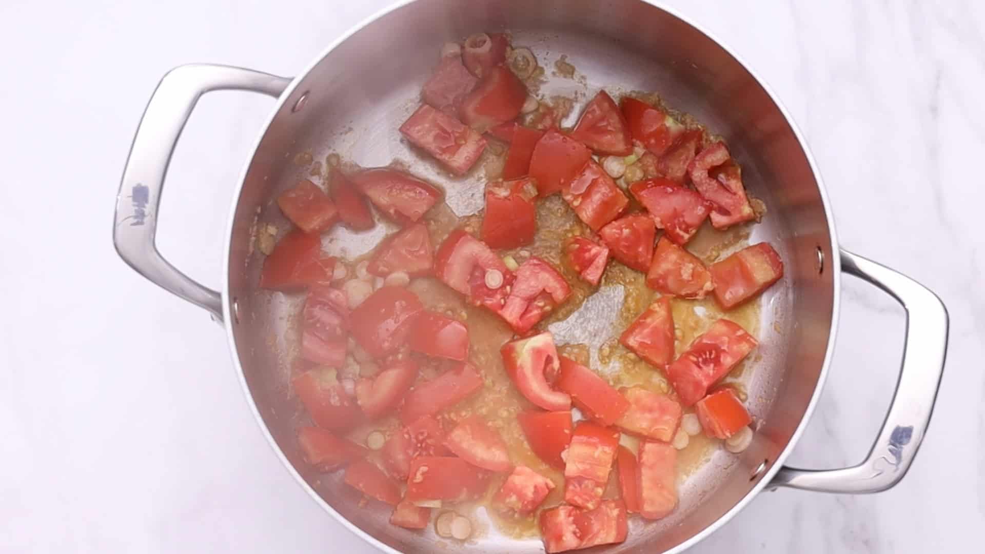 Tomato Egg Drop Soup 12 Add tomatoes, turmeric, black pepper, and chicken bouillon.