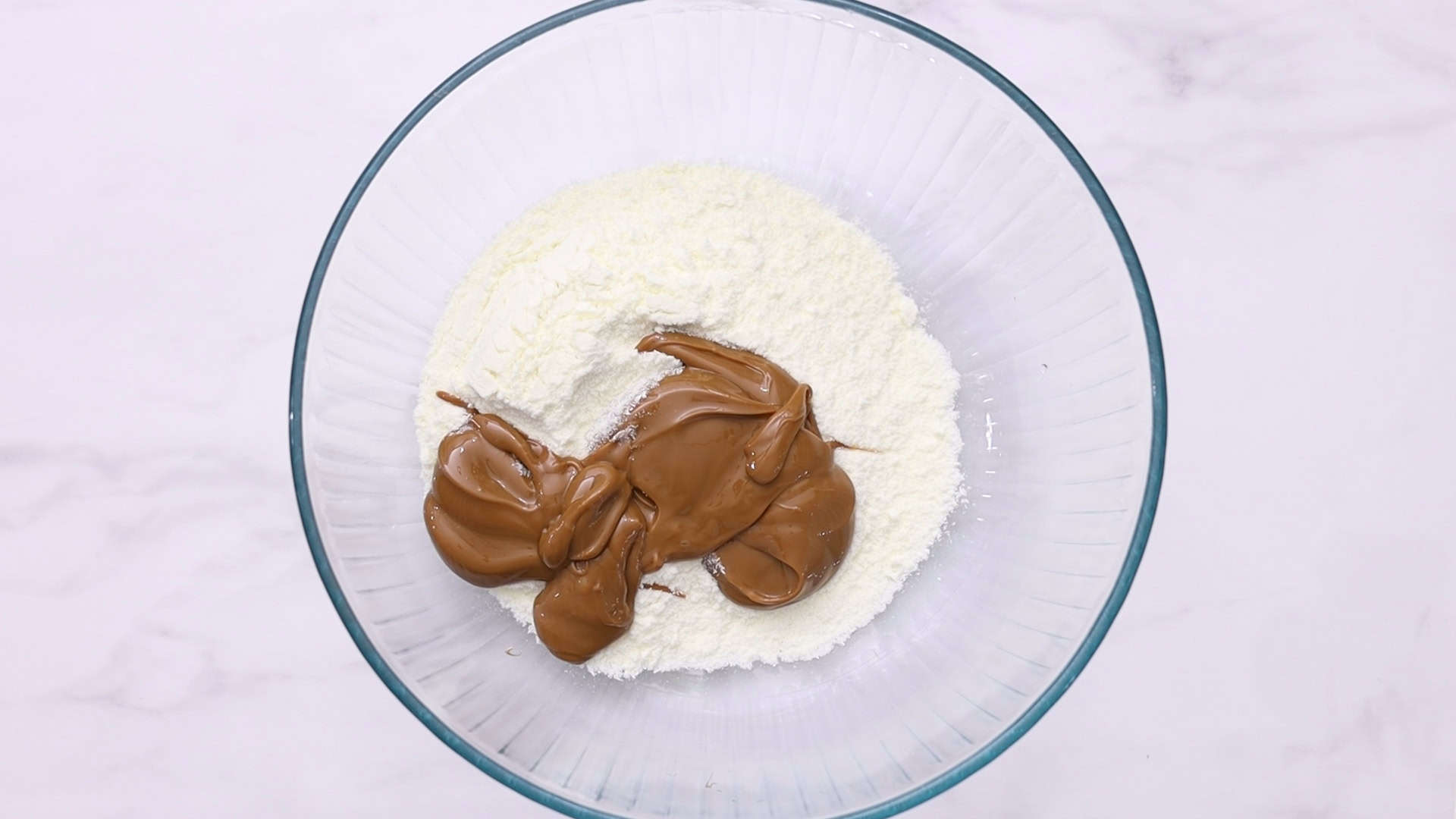 Combine dry milk and dulce de leche
