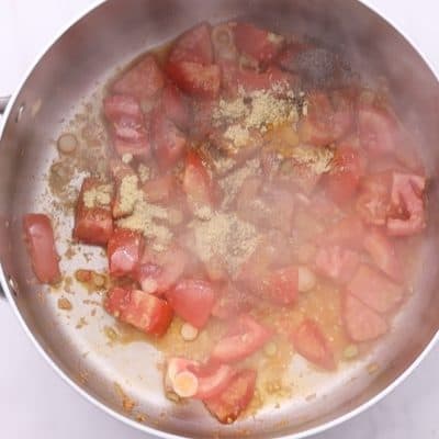 Cook until tomatoes blister, 2-3 minutes.