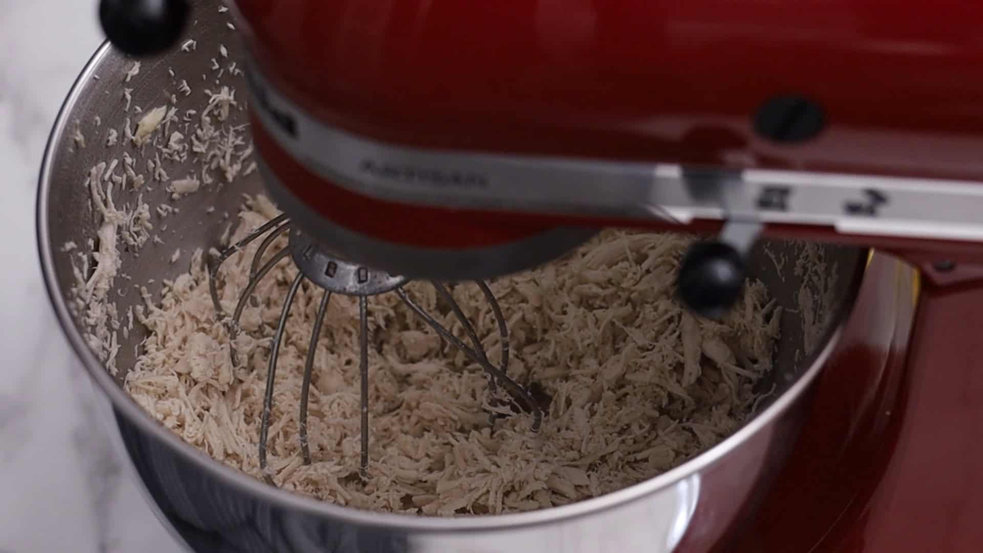 Easy Make-Ahead Chicken Fillings ( 2 WAYS ) 15 While hot, shred chicken using a stand mixer with a whisk attachment for 1 minute, or use a fork.