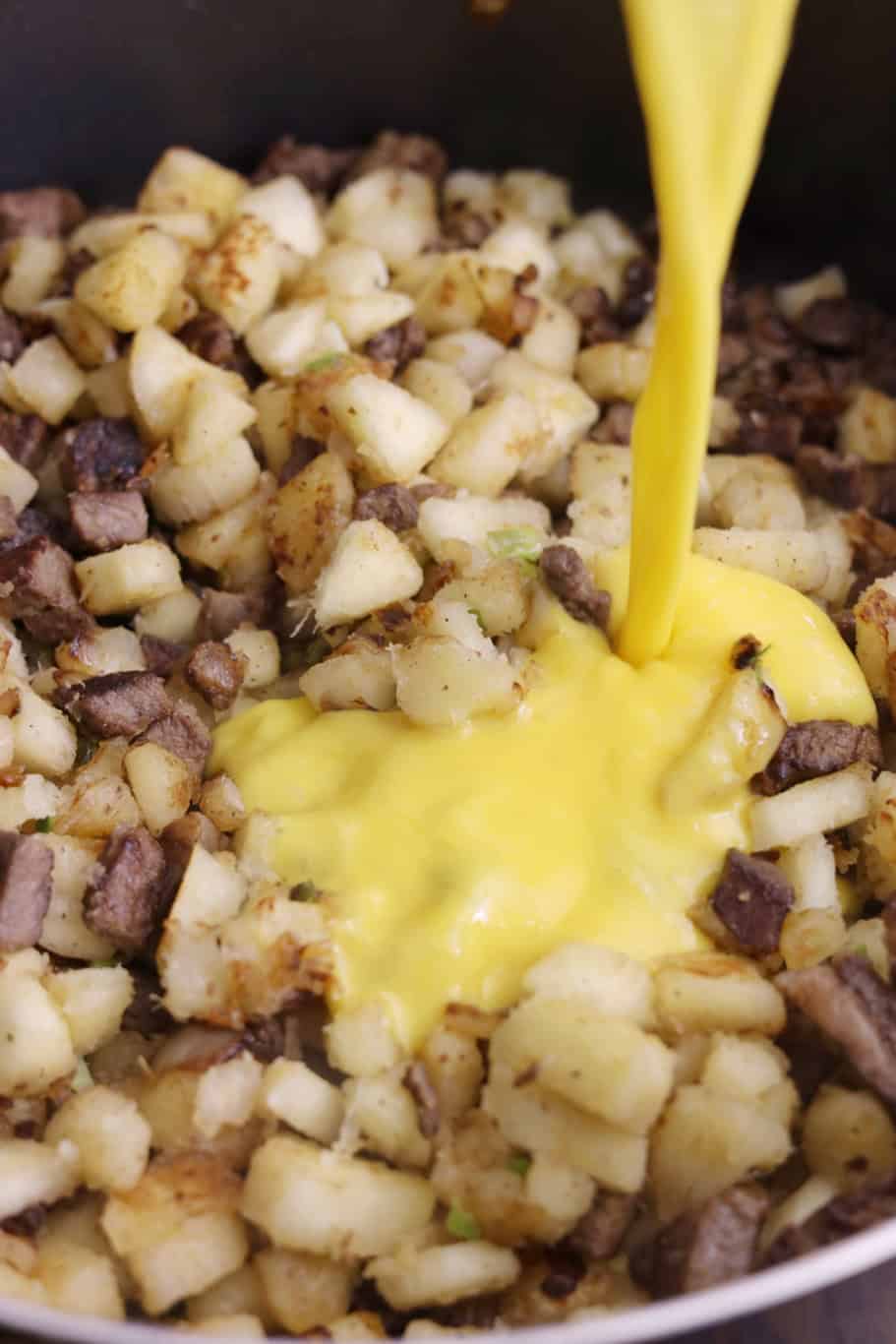 pouring eggs in a pot