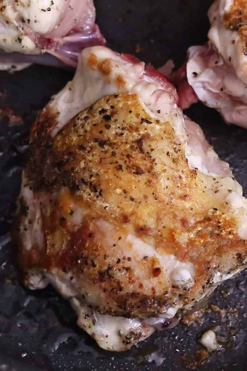 Chicken thigh on the skillet