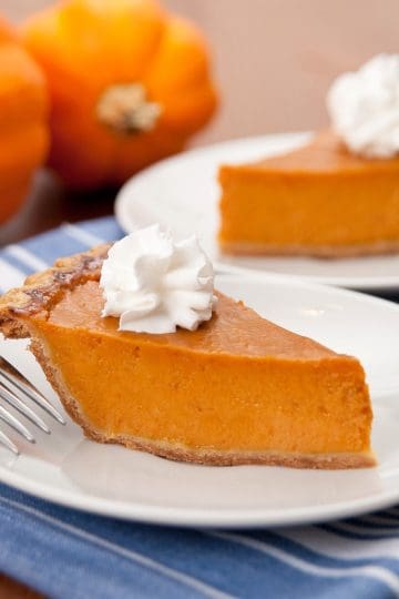 Pay de Calabaza tithe whipped cream in a plate