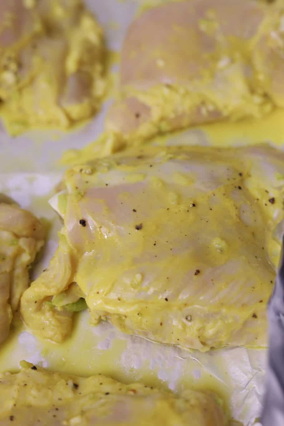 Raw chicken thing cover with mustard