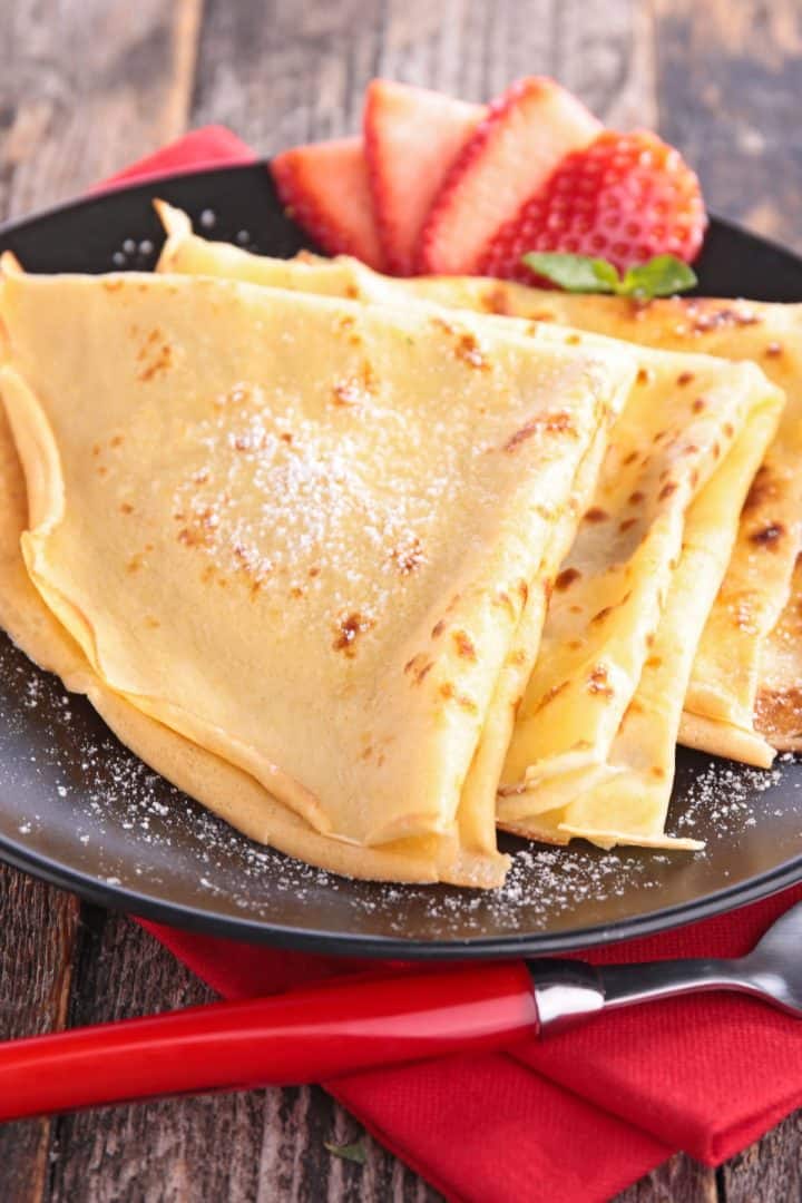 Crepas 10 Crepas (also known as crêpes) with strawberry in a plate