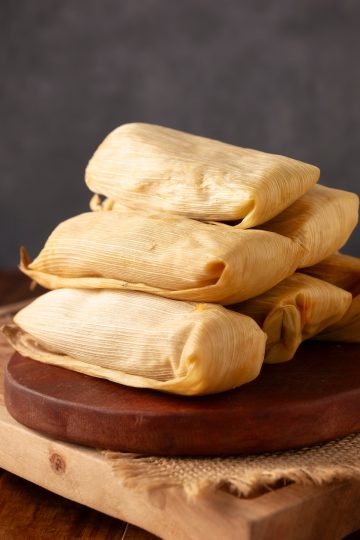 Tamales Rojos in a cutting board close up