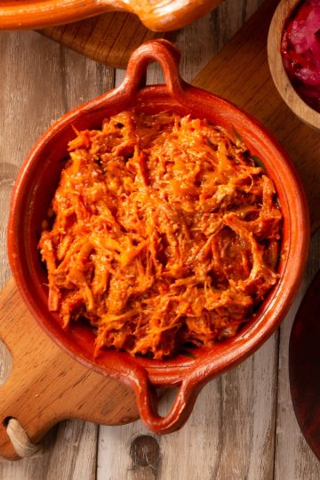 Cochinita Pibil in a clay bowl