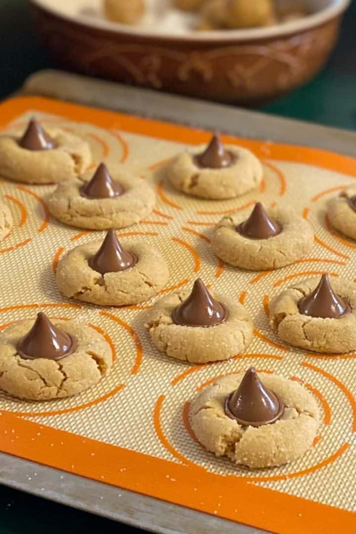 Peanut Butter Cookies with Chocolate Kisses coming from the oven