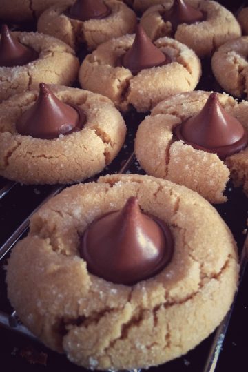 Peanut Butter Cookies with Chocolate Kisses in a cooling rack