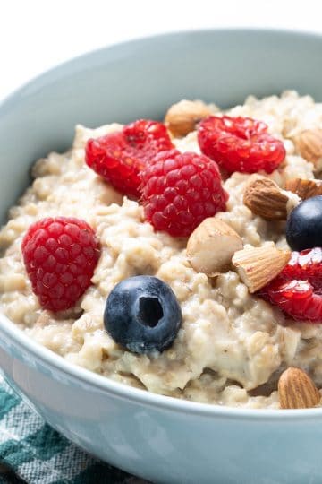 Avena con Leche with blueberries top view close up