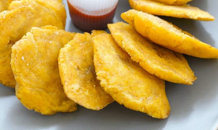 Platanos Fritos with salsa in a plate