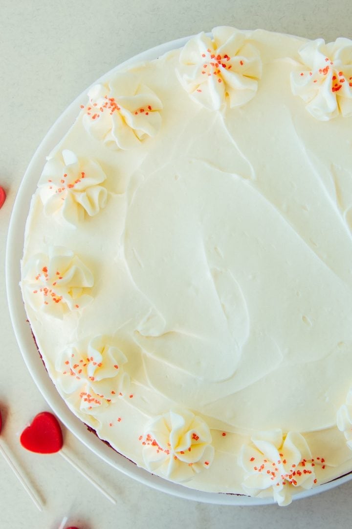 Red Velvet Cake and Cream Cheese Icing 5 Red velvet cake with cream cheese icing frosting top view close up