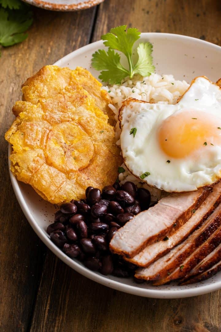 Tostones with fried egg and beans
