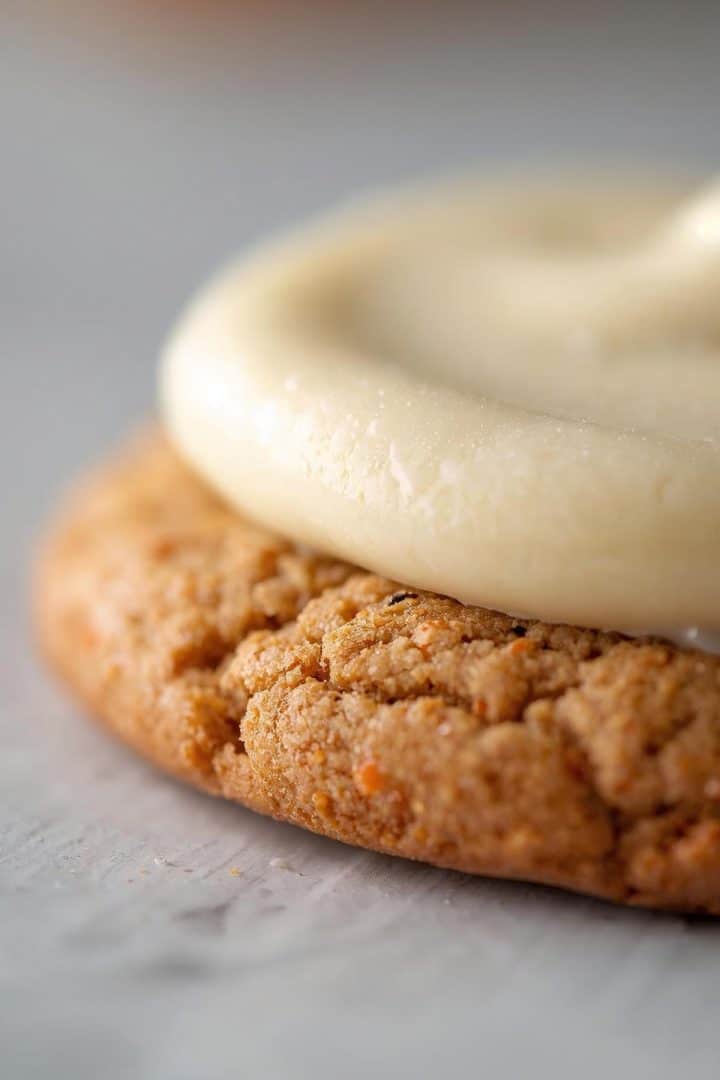 Carrot Cake Cookies 5 Extreme close-up macro of a thin carrot cake cookie with smooth, flat cream cheese